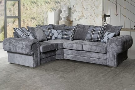 LEFT HAND FACING: A scatter back fabric corner sofa