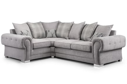 LEFT HAND FACING: A scatter back fabric corner sofa