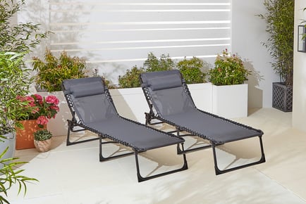 CREAM: A pair of outdoor sun loungers