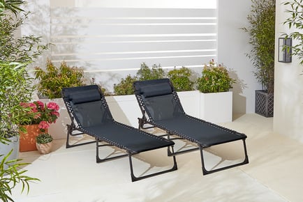 CREAM: A pair of outdoor sun loungers