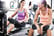Two friends chatting whilst on rowing machines