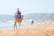Beduin riding a camel on the main beach of Agadir, Morocco