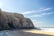 Praia Grande golden sand beach in the Sintra region huge cliffs rise up from the beach on the Atlantic ocean coastline, Portugal