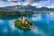 Bled, Slovenia - Aerial view of Lake Bled (Blejsko Jezero) with the Pilgrimage Church of the Assumption of Maria, pletna boats, Bled Castle