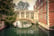 Someone on a gondola going down the canals of Cambridge