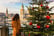 Young woman view from the back stands on the background of sunny Christmas Salzburg, Austria. 3