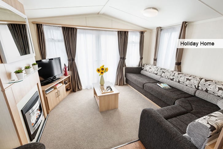 The living room of a holiday home at Flamingo Land