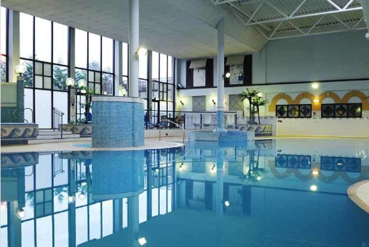 An indoor swimming pool at a Village Hotel
