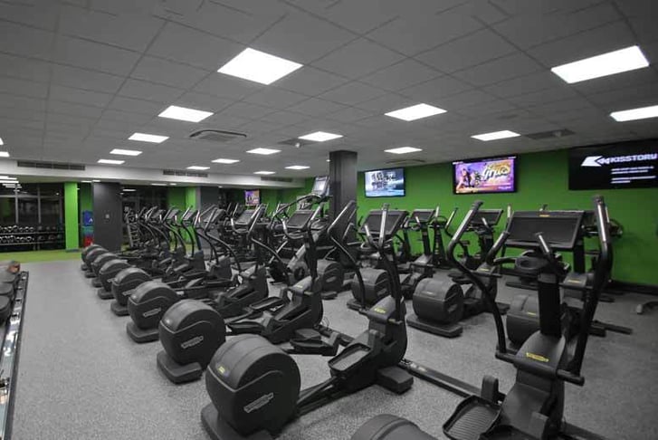 Rows of cross trainers in a gym