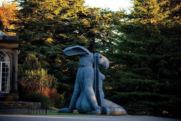 A bizarre statue of a woman's body with a rabbit's head
