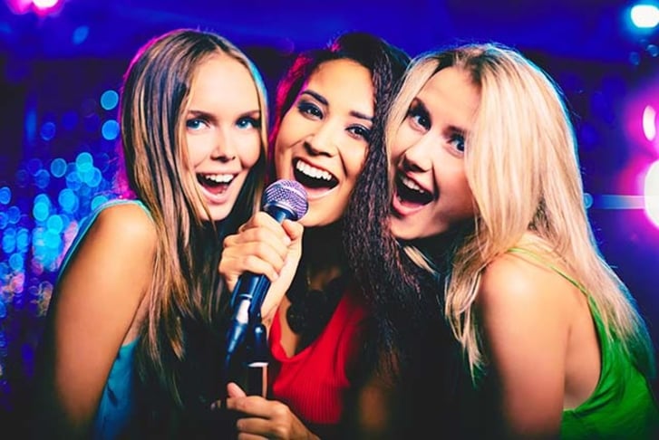 Three friends at karaoke 