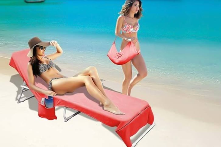 A Lounger Bag Towel being used by a woman on a beach