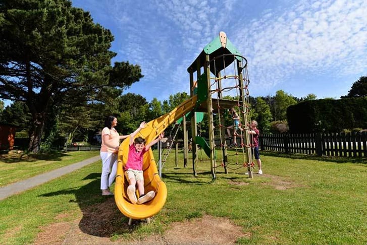 Kids enjoying the playground at a Parkdean Resort