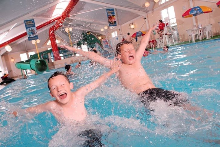 Kids having fun in an indoor swimming pool