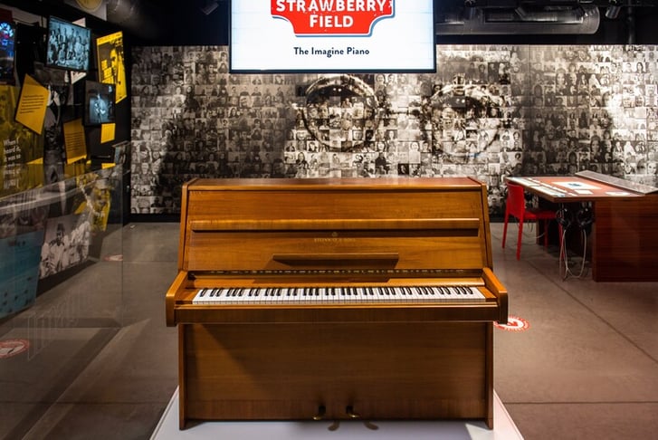 John Lennon's 'Imagine' piano in place at the Strawberry Field exhibition, on loan from the estate of George Michael. Photo credit - Ant Clausen