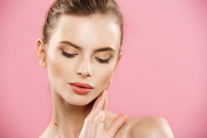 beauty-concept-beautiful-caucasian-woman-with-clean-skin-natural-make-up-isolated-bright-pink-background-with-copy-space