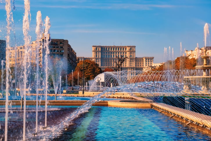 Famous building The Palace of the Parliament in Bucharest, the bigest landmark of Romania near the new fountains of capital.