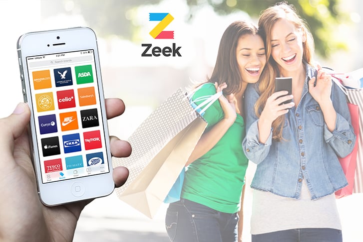 Two women using the Zeek app on their phone as they go shopping