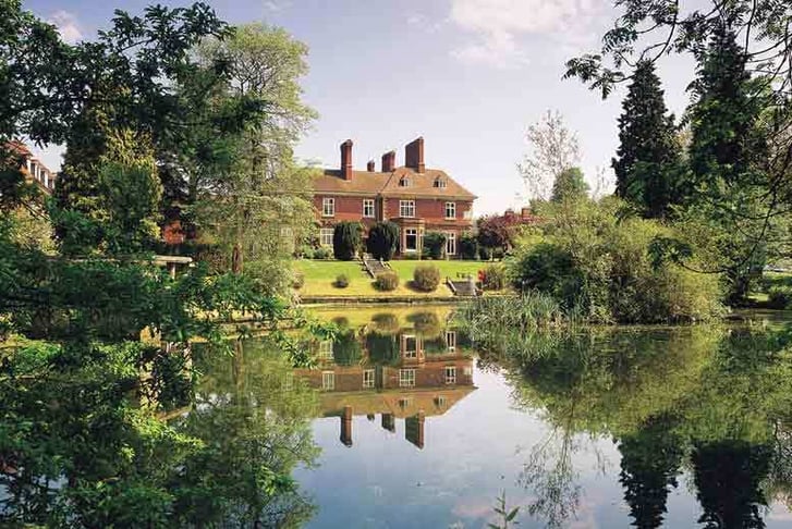 The exterior grounds and lake outside the Mercure Shrewsbury Albrighton Hall Hotel and Spa