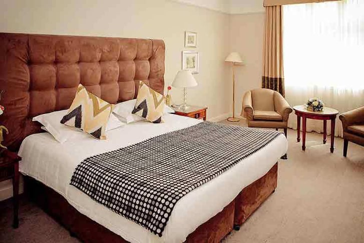 A double guest bedroom at Mercure Shrewsbury Albrighton Hall Hotel and Spa