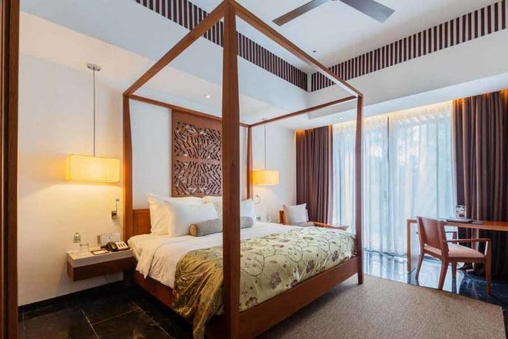A bedroom in a hotel in Hanoi
