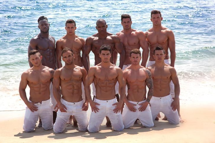 The Dreamboys Dancers on a beach with their tops off revealing their buff bods
