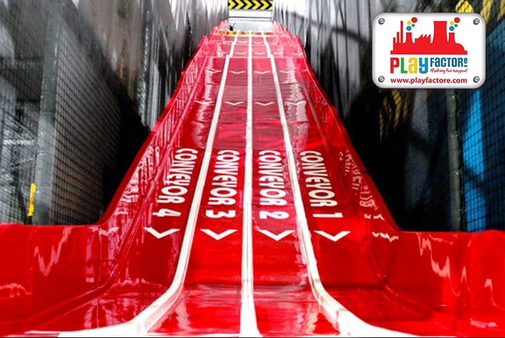 Big red slide with four lanes at Play Factore