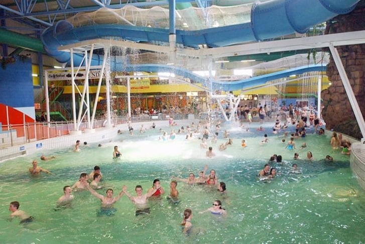 Lots of people in a giant swimming pool