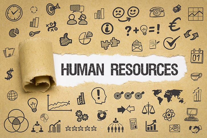 Brown paper peeled back to reveal the term 'Human Resources'