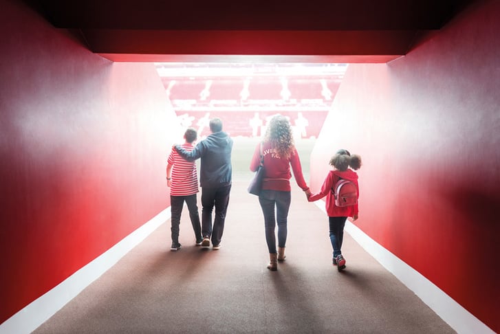 People walking up the tunnel at Anfield