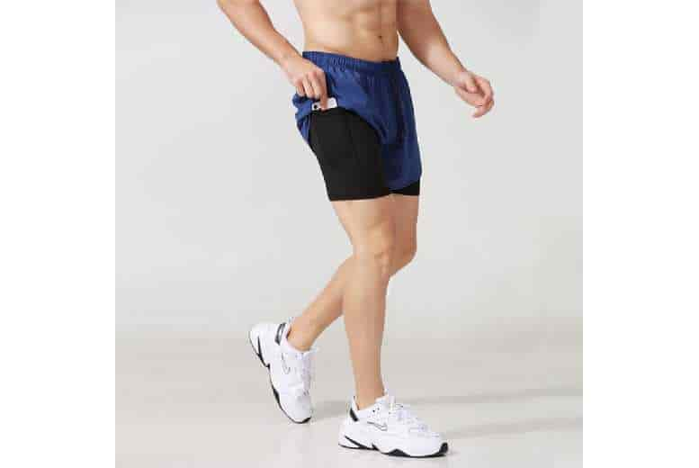 Running shorts with outlet back zipper pocket