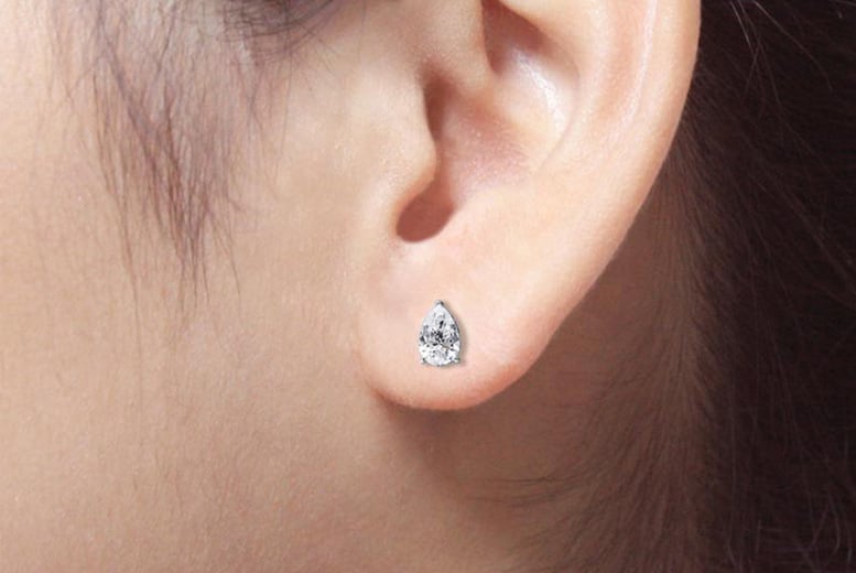 Diamond stud earrings in on sale gold